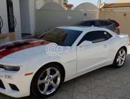 Camaro ss white with orange/red stripes Still un in Qatar