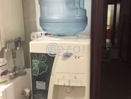 Water cooler+ two empty bottles in Qatar