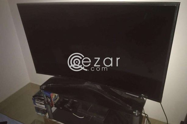 curved 55 inch UHD TV with quality glass cabinet photo 2