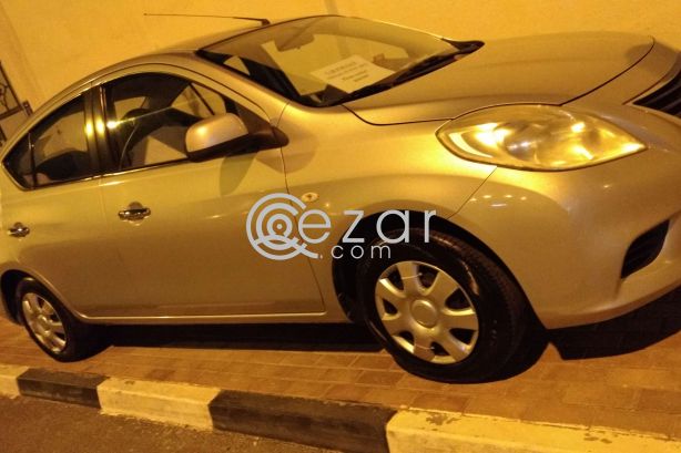 Nissan sunny 2012 (silver) photo 2