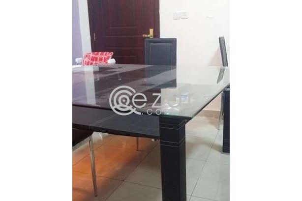 Dining table with eight leather chairs photo 1