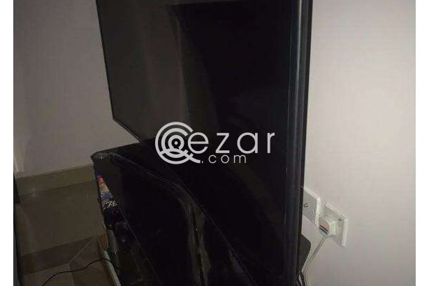 curved 55 inch UHD TV with quality glass cabinet photo 3