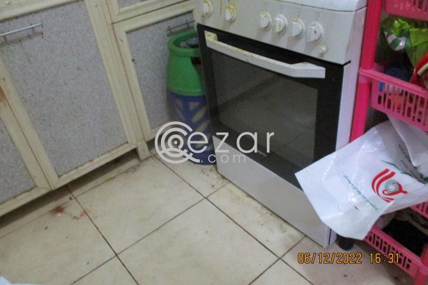 Stove with cylinder and regulator photo 1