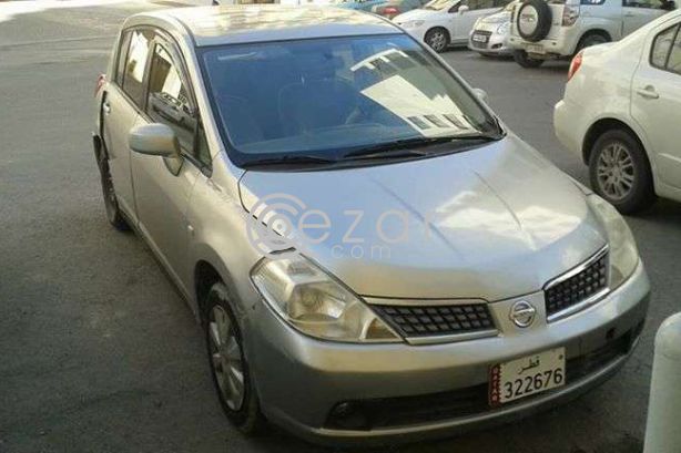 Tida hatchback photo 1