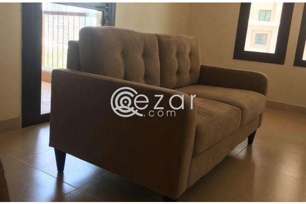 Beige 2 seater sofa photo 2